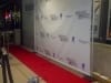 Celebrity step and repeat - Event at a Museum in Los Angeles CA.  Our rental company installed: 50\' Red carpet runner,Step and repeat frame, Chromed Stanchions,Black Velvet Ropes. also provided Chiavary Chairs and a Round 14\' Diameter Bar.      