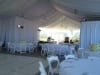 tent-swagging-white-pipe-and-drape The location a hotel rooftop in Beverly Hills CA 90210 The tent was swagged in white-other party rentals provided in this Beverly Hills Wedding: White pipe and drape,tables,white wood chairs, lighting,dance floor.    